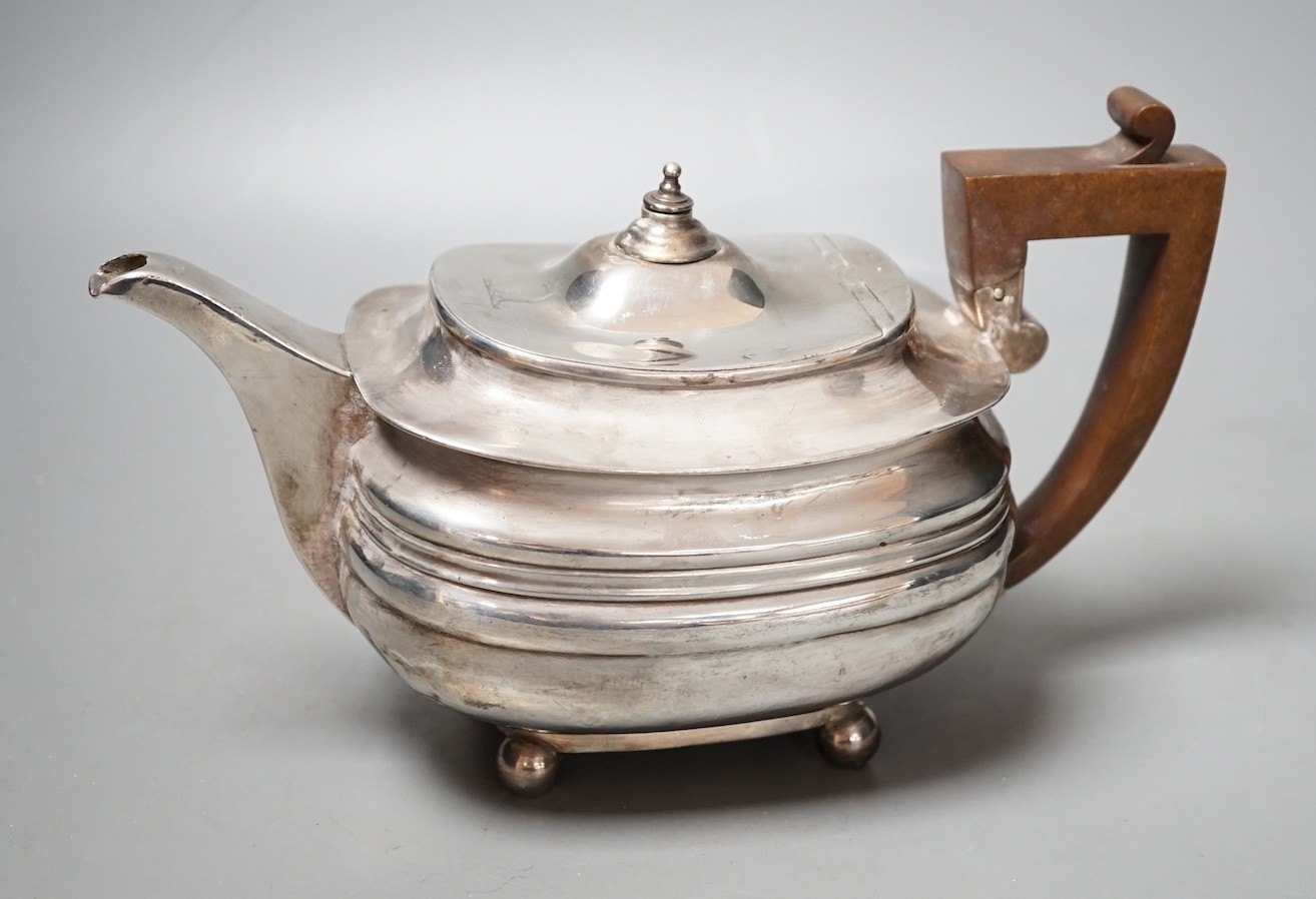 A George III silver teapot by Soloman Hougham, London, 1812, gross 16oz.